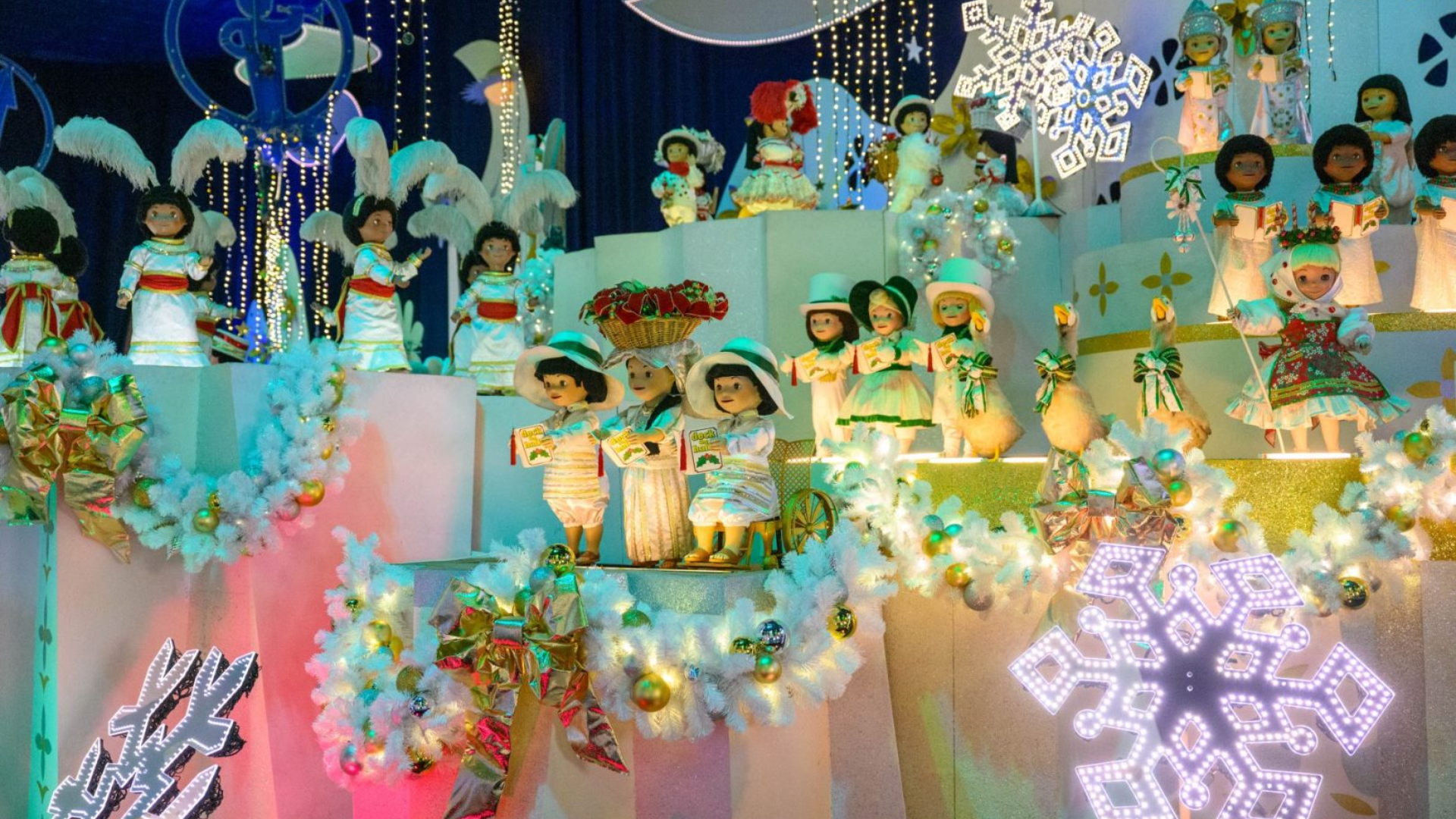 it's a small world Holiday with festive scenes and decorations