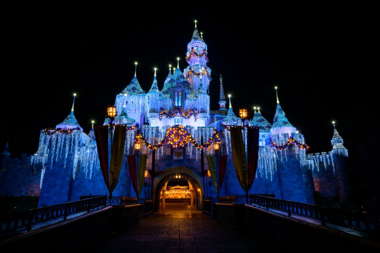 Sleeping Beauty Castle decorated with holiday lights and winter cheer