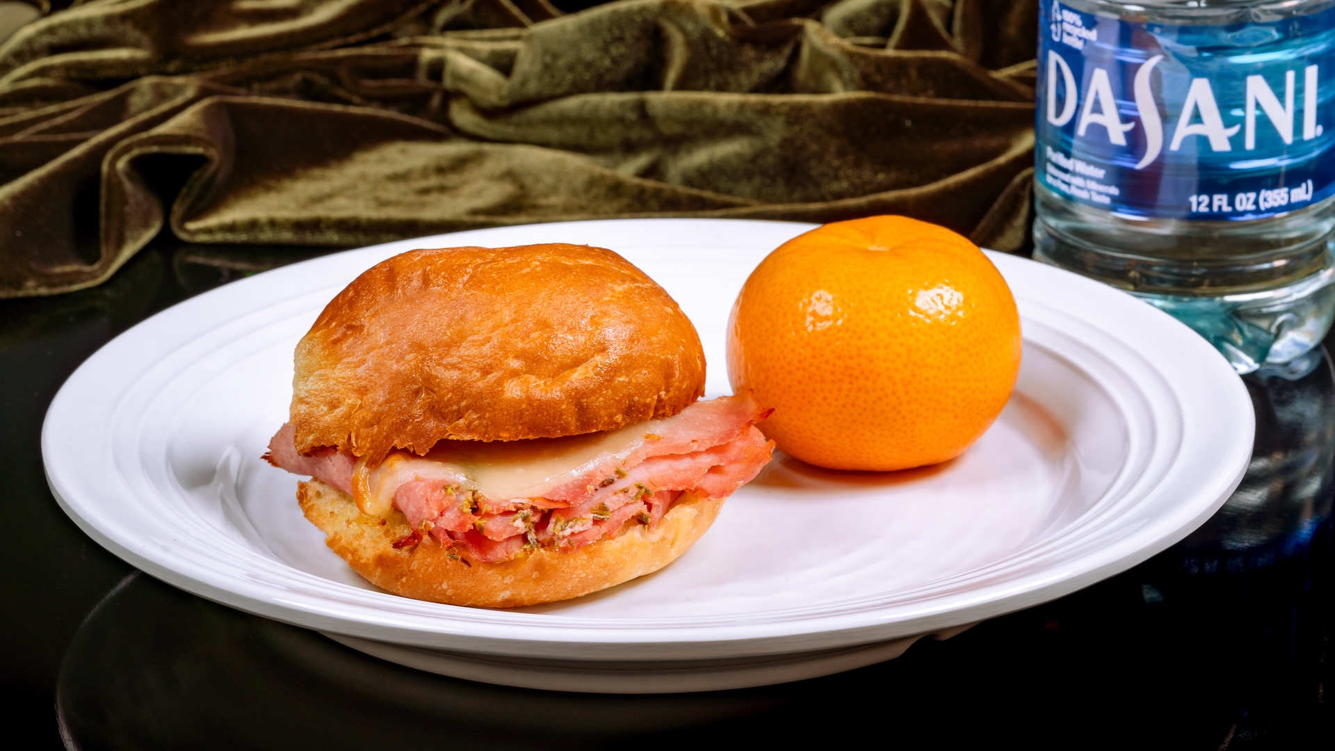 Tiana's Palace toasted ham and cheese sandwich with mandarin orange and applesauce