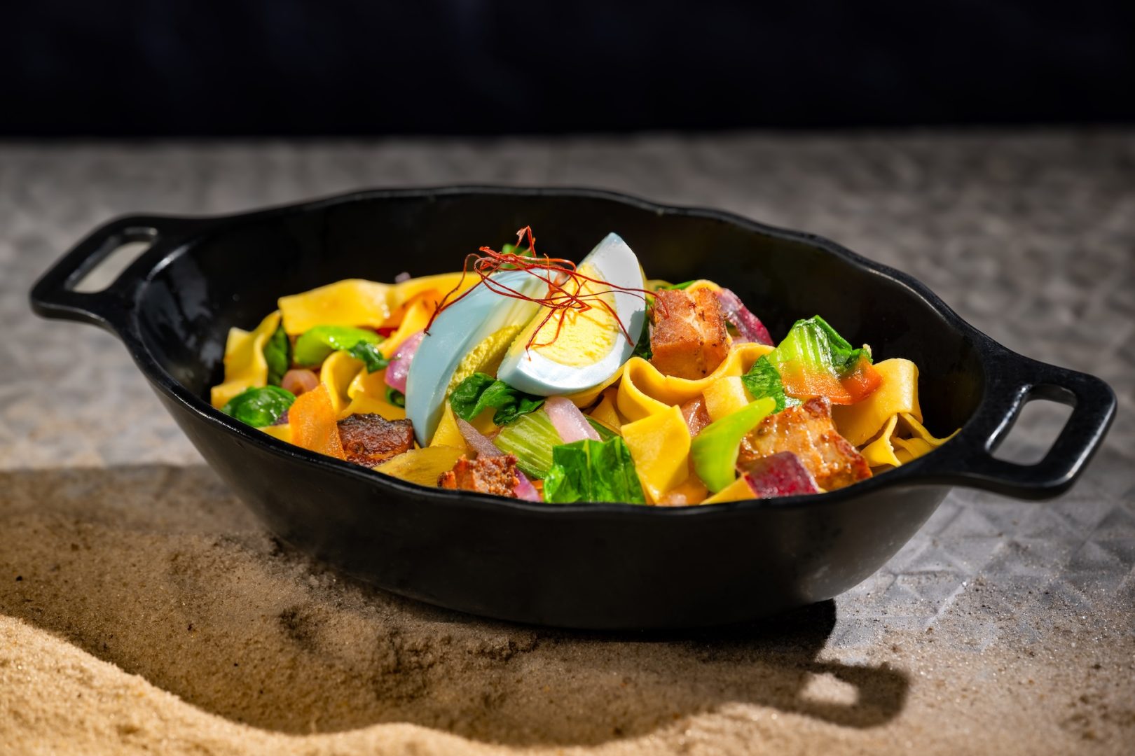 Sweet-and-Spicy Puffer Pig Pasta with flat noodles, pork belly, and bok choy