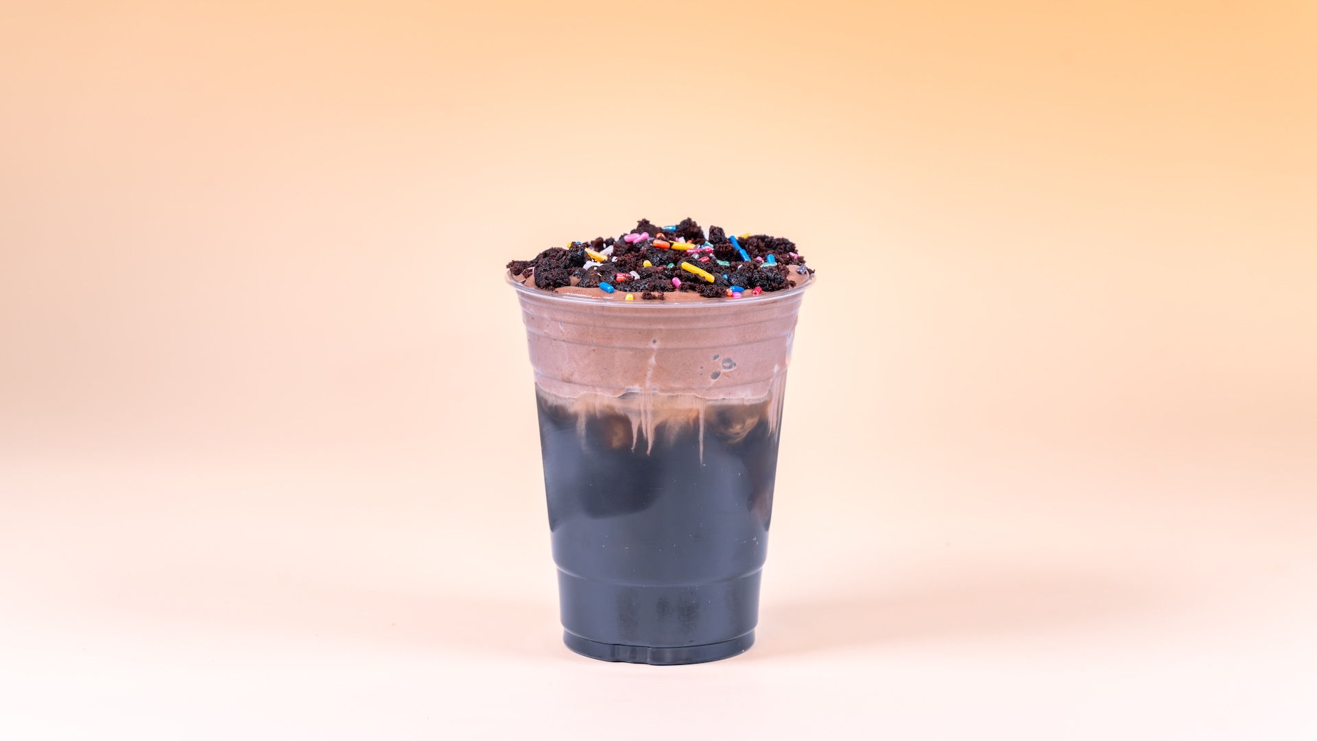 Mud Cake Cold Brew with malted milk, fudge brownie bits, and sprinkles
