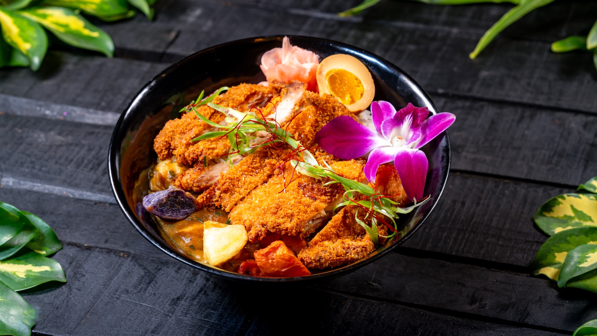 Chicken Katsu Curry served with jasmine rice and soy-marinated egg