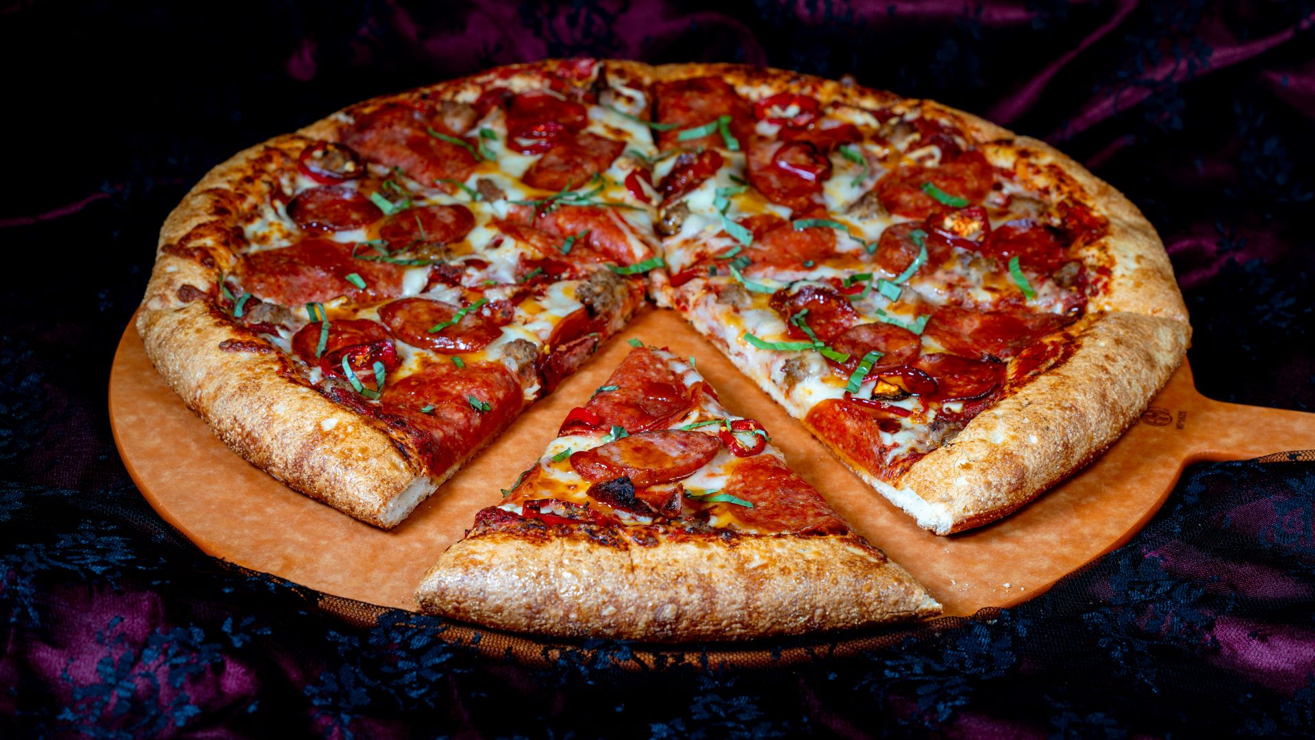 Seasonal food offerings like pizza from Alien Pizza Planet