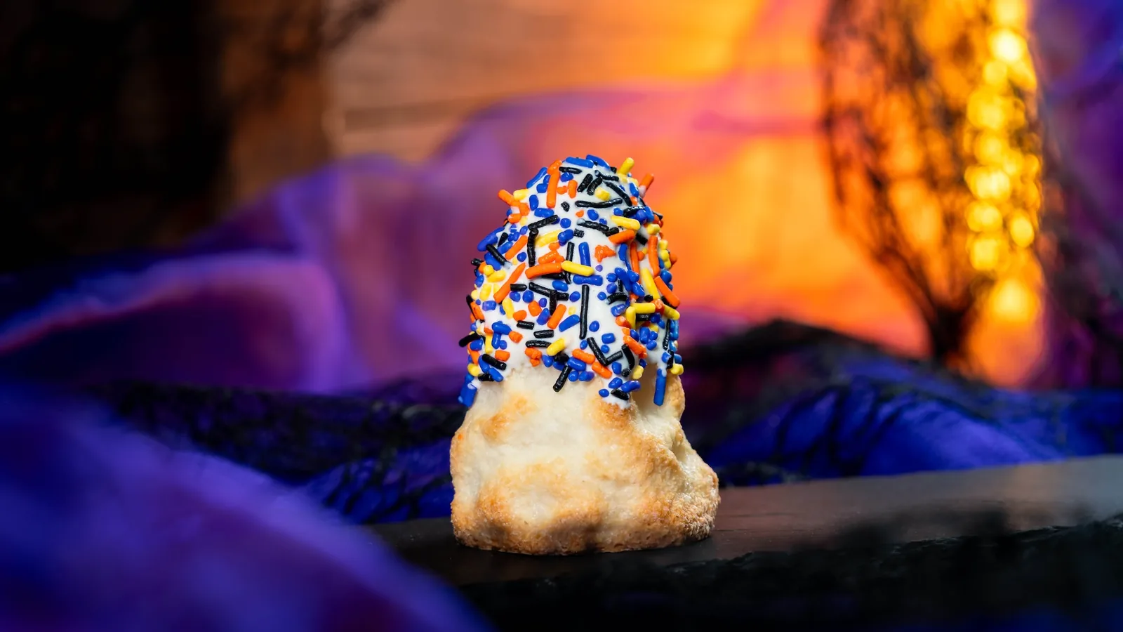 Rest in Chocolate: Chocolate ice cream in chocolate waffle cup with cookie crumbles, gummy worms, and chocolate tombstone