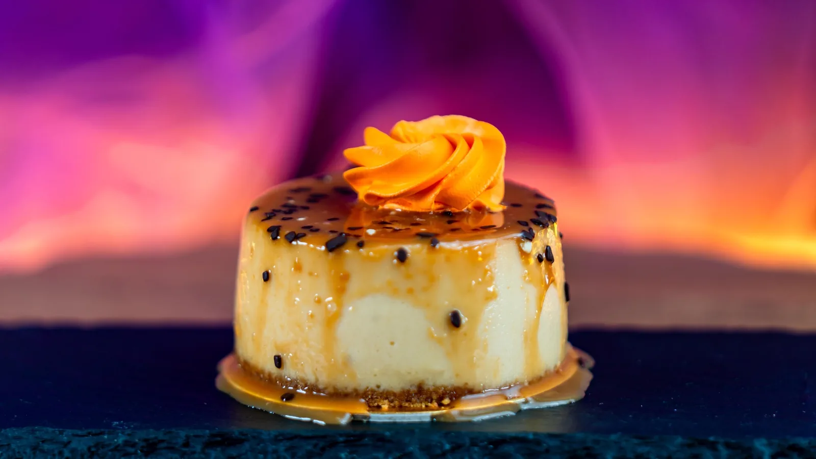 Caramel Apple Cheesecake with caramel filling and orange white chocolate mousse