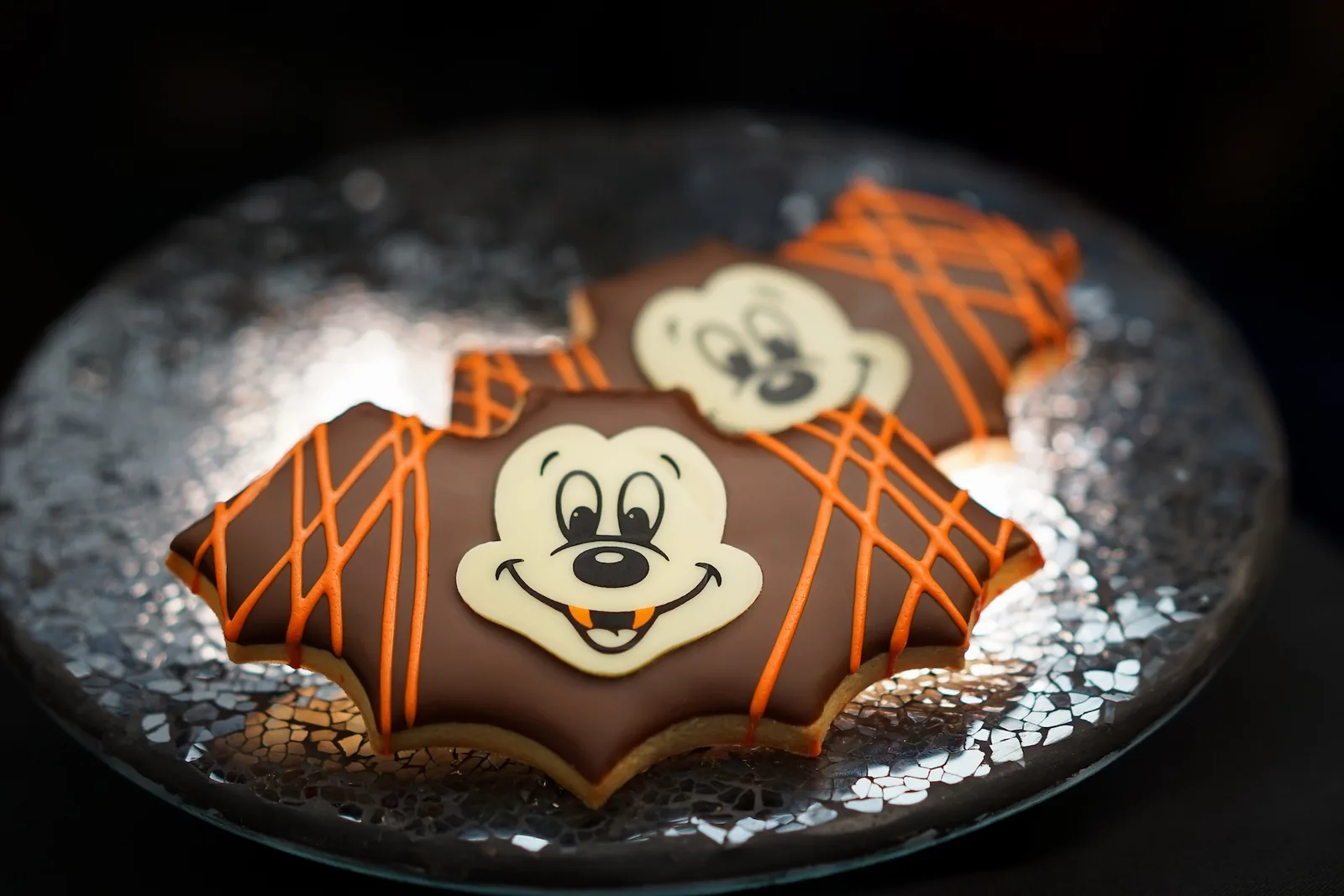 Shortbread Bat Cookie dipped in dark chocolate with vampire Mickey face