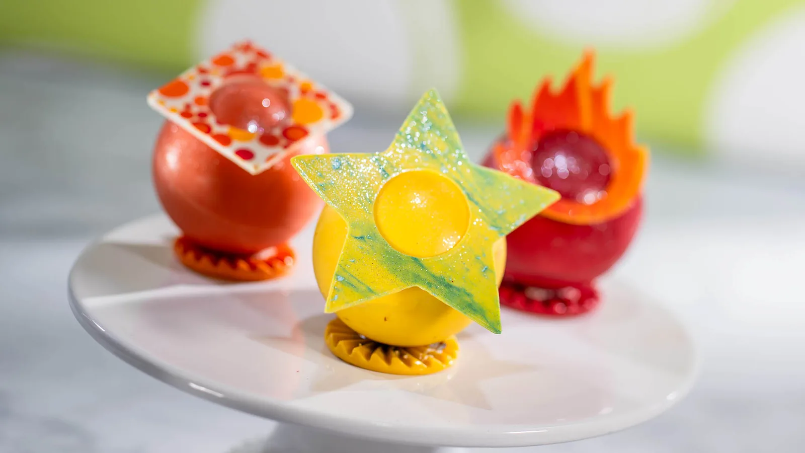 Chocolate spheres and decorated treats representing different emotions