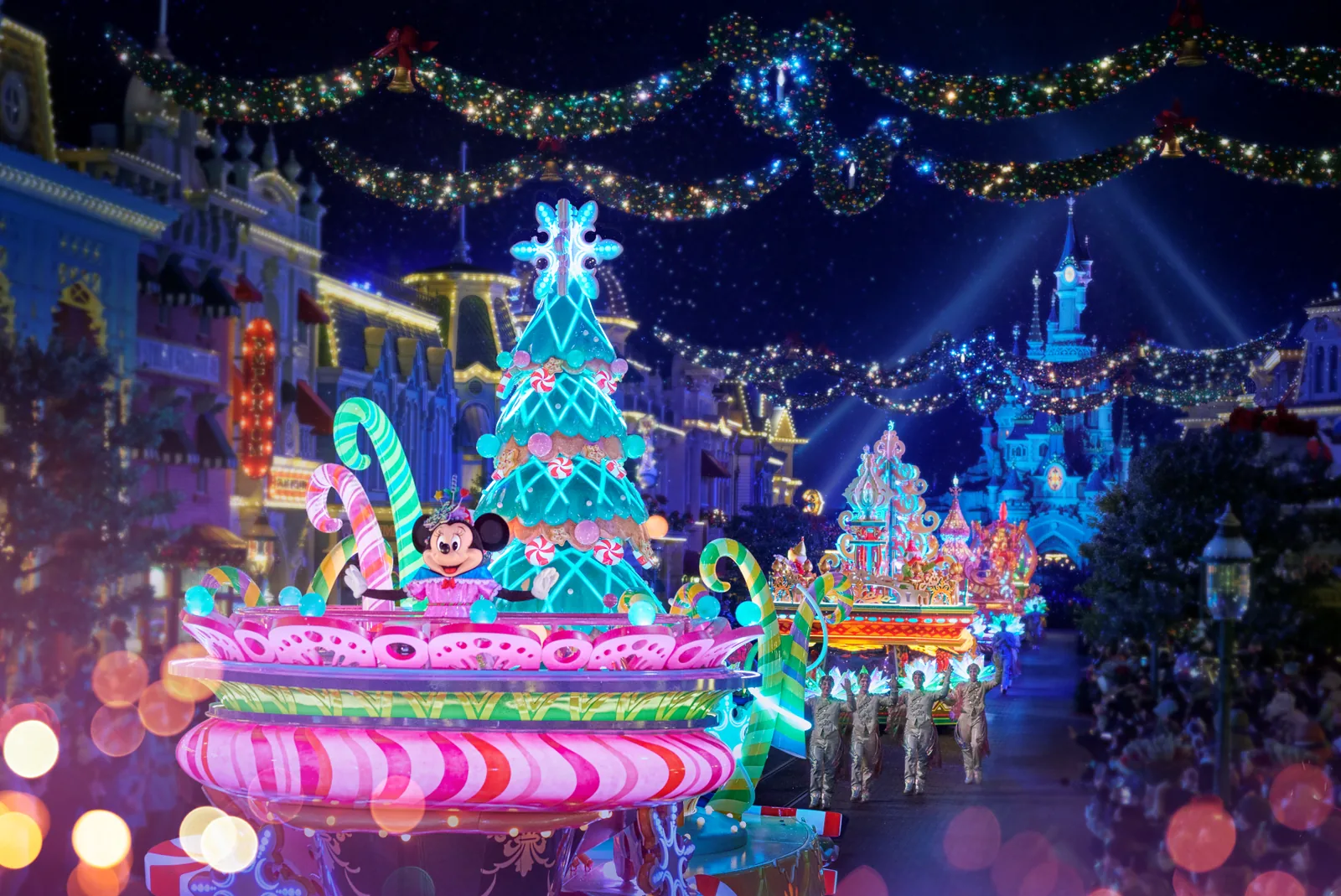 Mickey's Dazzling Christmas Parade with lit floats and Santa